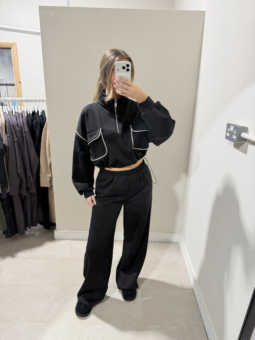 Black loungewear set with wide-leg trousers full-length view