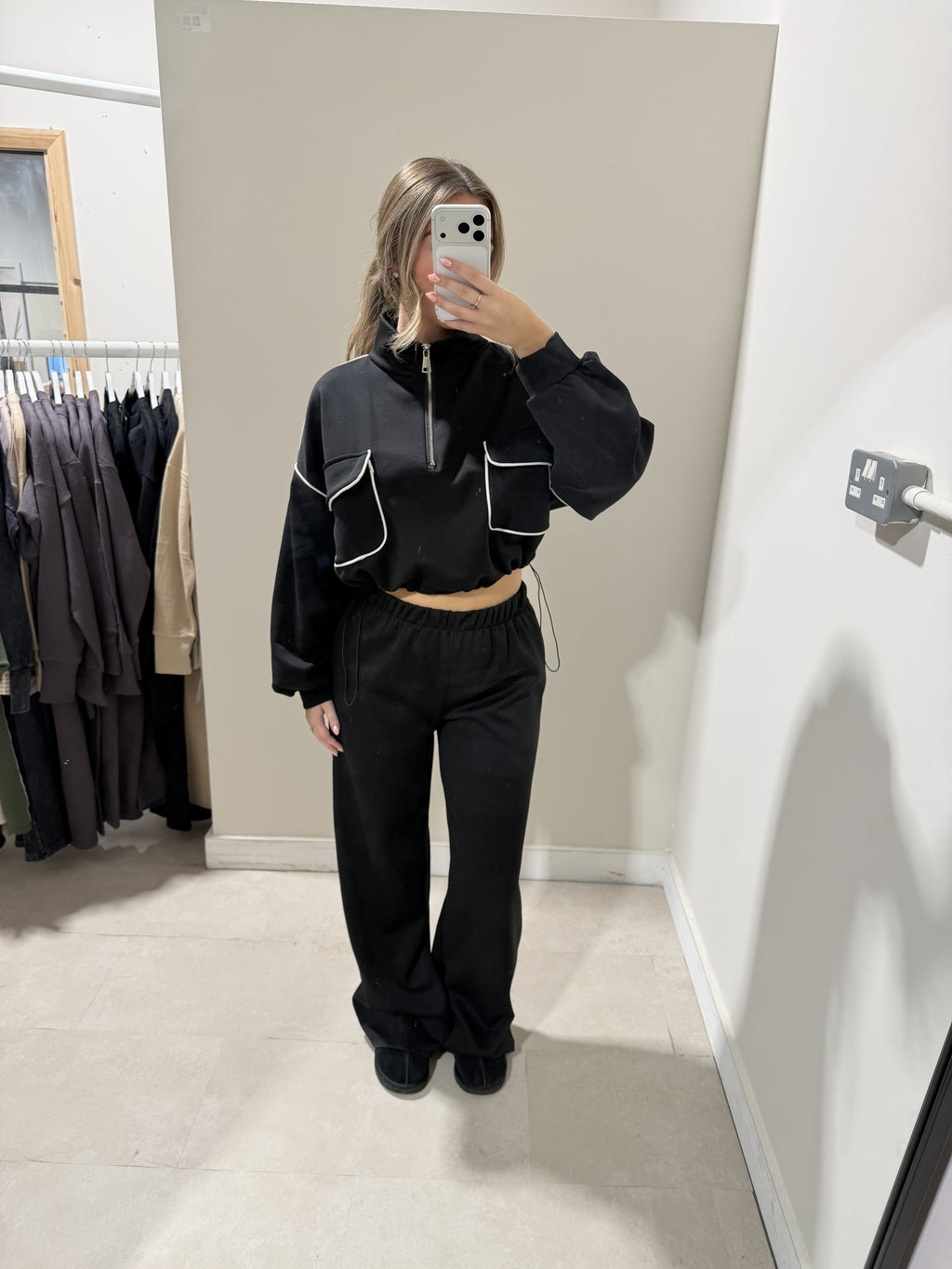 Black contrast-piped top and matching trousers front view