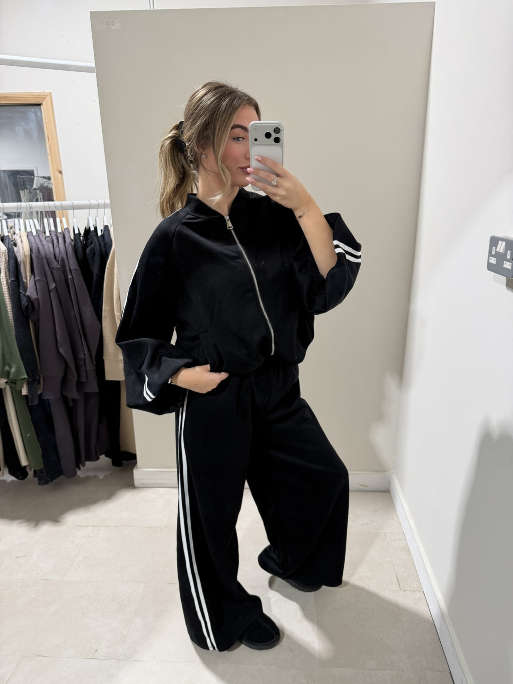 Black and white striped zip-front two-piece set front view